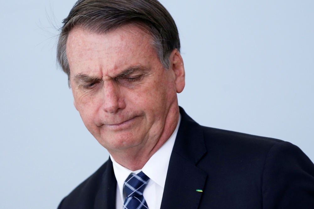 Brazil's President Jair Bolsonaro reacts during a ceremony to launch the program 'Doctors in Brazil' at the Planalto Palace in Brasilia, Brazil August 1, 2019. REUTERS/Adriano Machado
 