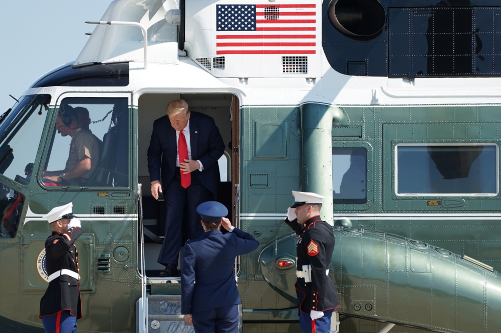 US President Donald Trump is seen in Marine One at Joint Base Andrews in Maryland, as he departs for a fundraising luncheon to benefit his reelection campaign and the Republican National Committee in Southampton, New York, U.S., August 9, 2019. (REUTERS/S