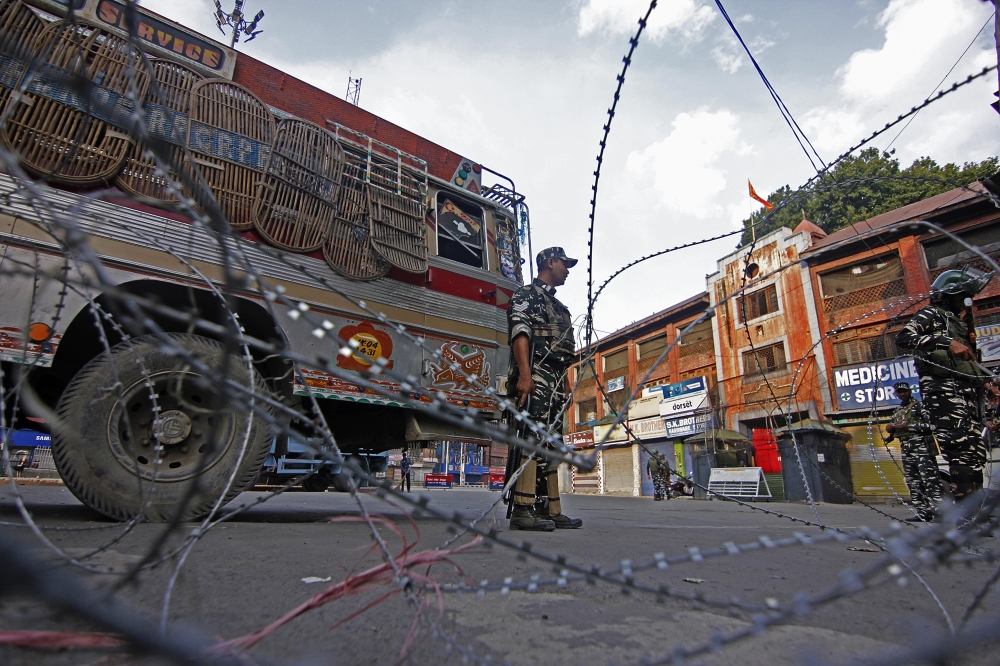 Indian security personnel patrol on a street during a curfew in Srinagar, Kashmir, India on August 06, 2019. Faisal Khan - Anadolu 