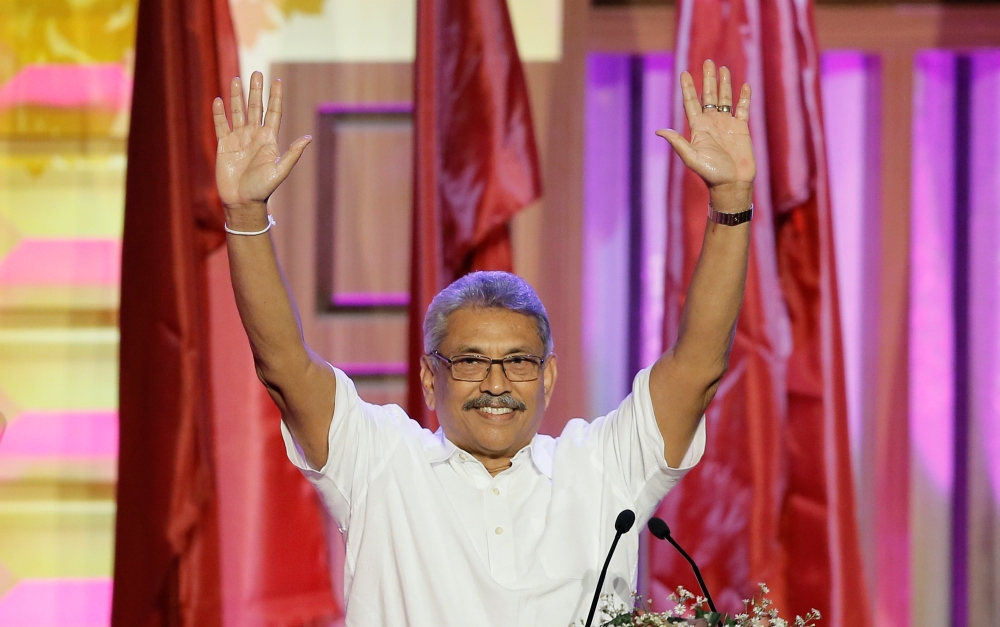 Sri Lanka's former defense secretary Gotabaya Rajapaksa waves after he was nominated as a presidential candidate during the Sri Lanka People's Front party convention in Colombo, Sri Lanka August 11, 2019. (REUTERS/Dinuka Liyanawatte)