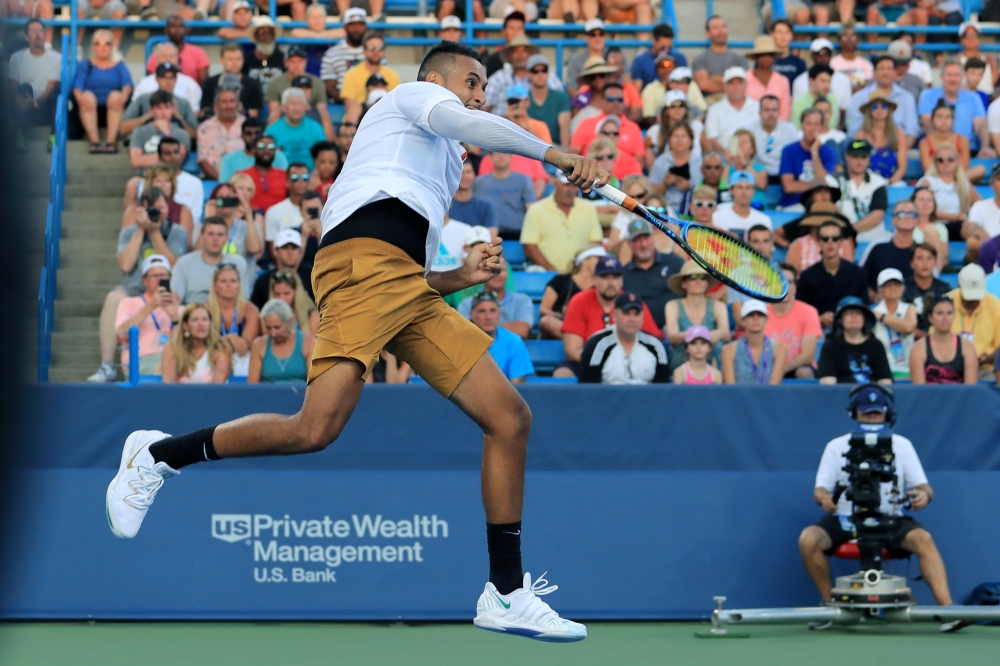 Nick Kyrgios (AUS) leaps to return a shot against Lorenzo Sonego (ITA) during the Western and Southern Open tennis tournament at Lindner Family Tennis Center. (Aaron Doster-USA TODAY Sports)