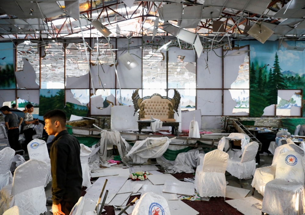 Workers of a wedding hall inspect after a blast in Kabul, Afghanistan August 18, 2019. REUTERS/Mohammad Ismail TPX IMAGES OF THE DAY