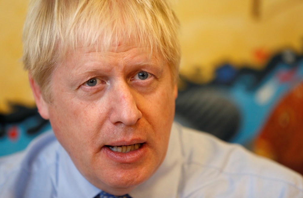 Britain's Prime Minister Boris Johnson talks as he meets with health professionals during his visit to the Royal Cornwall Hospital in Truro, Britain, August 19, 2019. REUTERS/Peter Nicholls