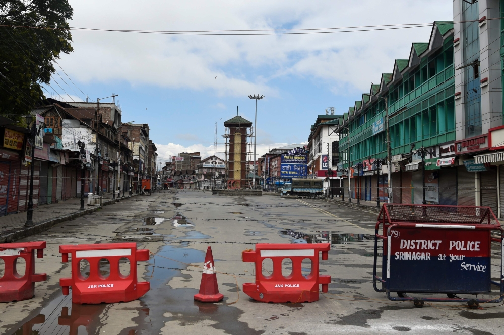 In this file photo taken on August 19, 2019, the clock tower at deserted Lal Chowk is pictured during a security lockdown in Srinagar.  AFP / PUNIT PARANJPE 
