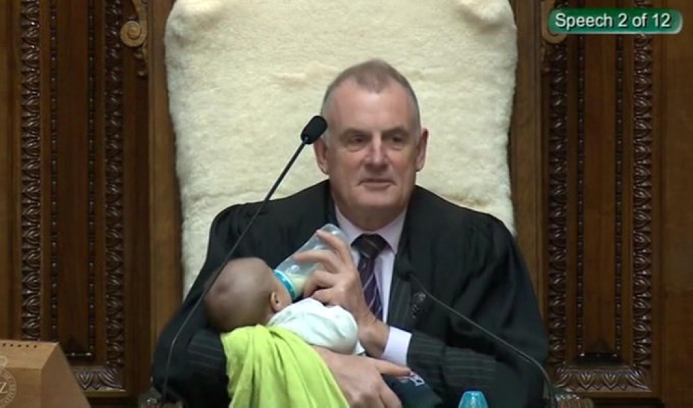 Screenshot from a Parliament broadcast of New Zealand Speaker Trevor Mallard feeding a Member of Parliament’s baby during a parliamentary session in Wellington August 21, 2019. New Zealand Parliament and Speaker's Office/Handout via Reuters