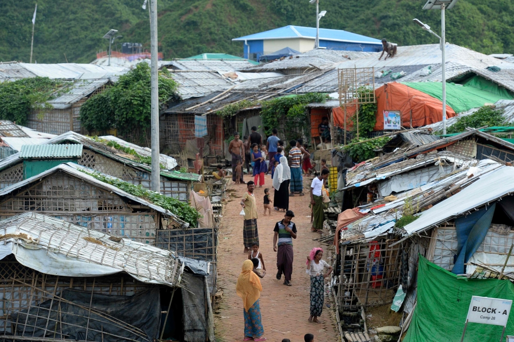 Rohingya people are seen at a camp in Teknaf on August 21, 2019. / AFP / MUNIR UZ ZAMAN