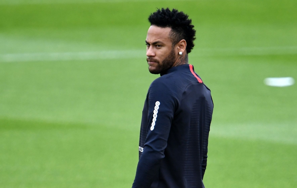 Paris Saint-Germain's Brazilian forward Neymar looks on as he takes part in a training session in Saint-Germain-en-Laye, west of Paris, on August 17, 2019, on the eve of the French L1 football match between Paris Saint-Germain (PSG) and Rennes. / AFP / FR