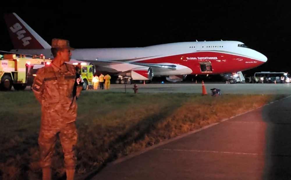 Handout picture released by Bolivia's Presidency showing a Supertanker, an aerial firefighting airtanker, after it landed at Viruviru airport in Santa Cruz de la Sierra, on August 23, 2019, to help fight the fires raging in eastern Bolivia. (AFP PHOTO / B