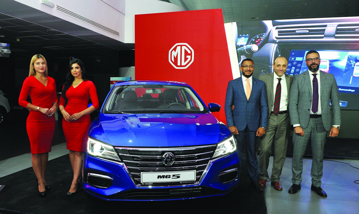 The Auto Class Cars officials Karim Monir, Head of Marketing; Hesham Al Sahn, General Manager; and Tamer Abdallah, MG Brand Manager; pose during the launch of MG5 in Doha on Wednesday evening. Pic: Salim Matramkot/The Peninsula