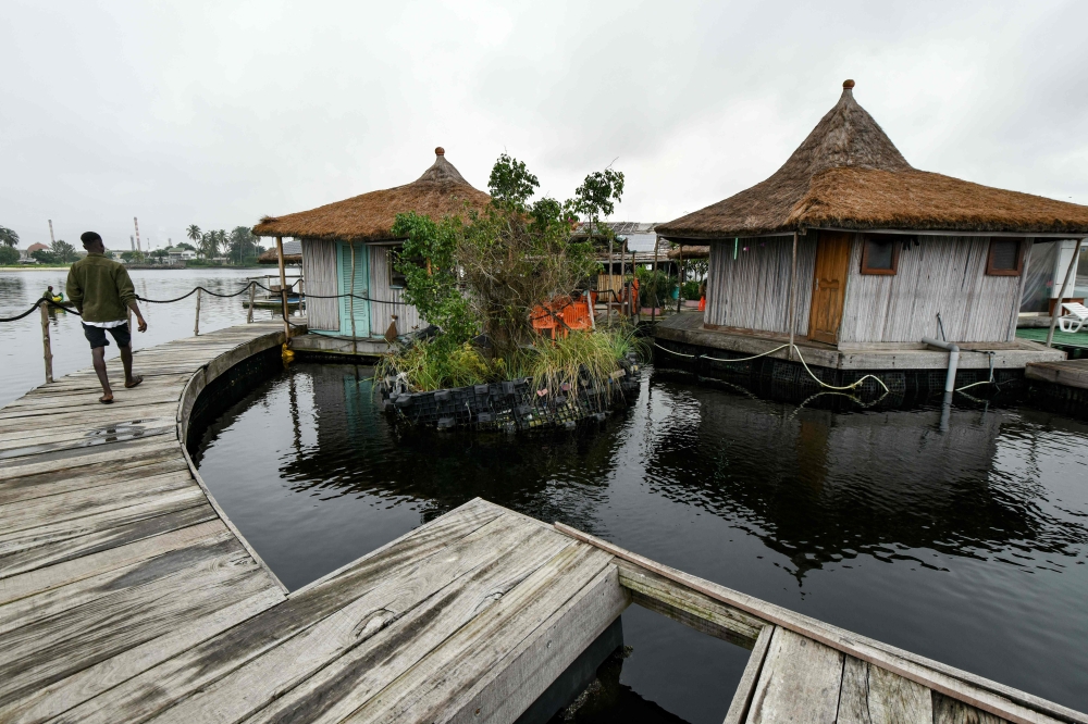 (FILES) This file photo taken on August 6, 2019 shows a view of the resort on an artificial island made with around 700 000 recycled plastic waste collected in the surrounding area, on the Ebrie Lagoon in Abidjan, Ivory Coast. AFP / ISSOUF SANOGO