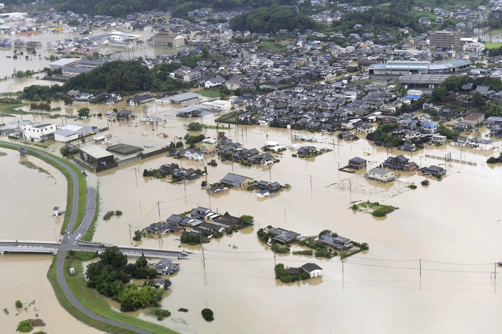 An aerial view shows submerged houses and facilities at a flooded area in Takeo, Saga prefecture, southern Japan August 28, 2019, in this photo taken by Kyodo. Kyodo/via REUTERS 