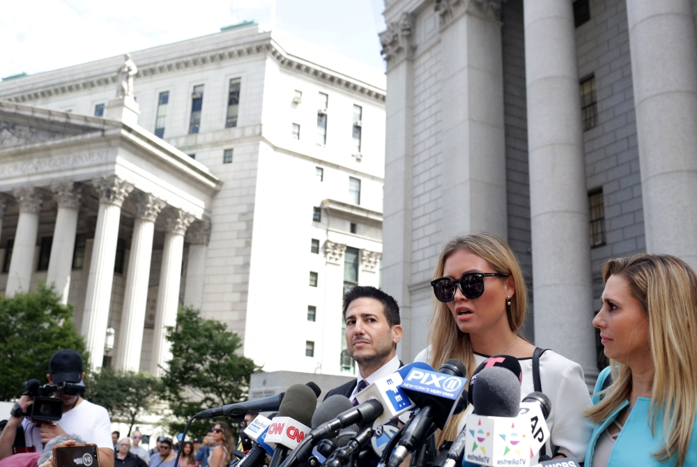 Jennifer Araoz (2nd R), one of deceased financier Jeffrey Epstein's alleged victims, and her attorney Kimberly Lerner (R), speak to the press outside the US Federal Court on August 27, 2019 in New York. AFP / Yana Paskova
 