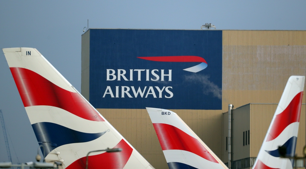 FILE PHOTO: British Airways logos are seen on tail fins at Heathrow Airport in west London, Britain, February 23, 2018. REUTERS/Hannah McKay/File Photo
