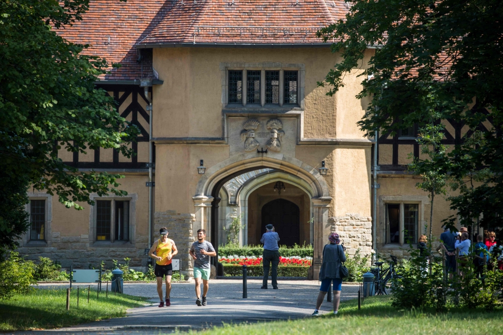 In this file photo taken on August 02, 2019 Tourists visit Cecilienhof palace in Potsdam on August 2, 2019. AFP / Odd Andersen 