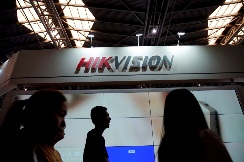 People visit a Hikvision booth at a security exhibition in Shanghai, China May 24, 2019. Reuters/Aly Song