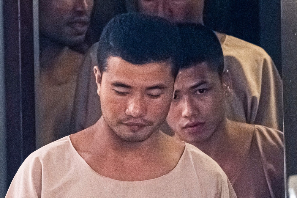  Myanmar prisoners Zaw Lin (C) and Win Zaw Tun (R) leave the court in Nonthaburi after the verdict on August 29, 2019. AFP / Mladen Antonov 