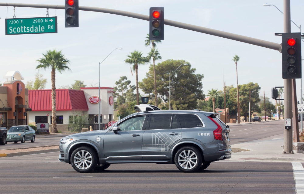 A self driving Volvo vehicle purchased by Uber moves through an intersection in Scottsdale, Arizona, December 1, 2017. Reuters/Natalie Behring