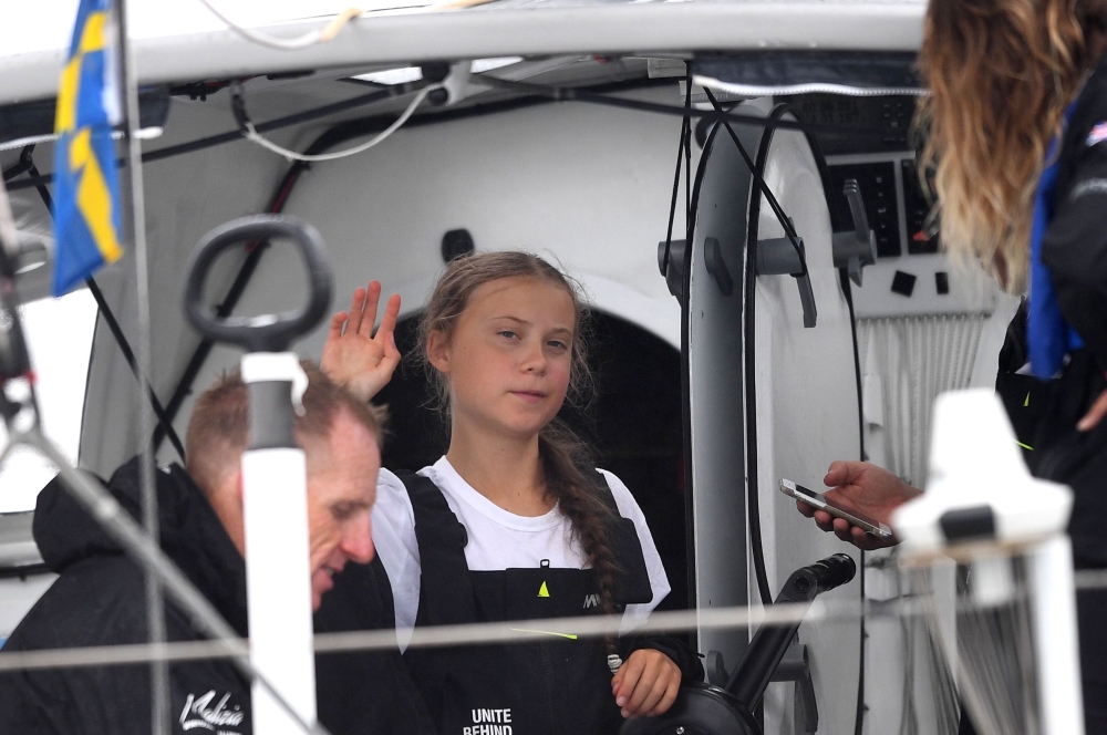 Swedish climate activist Greta Thunberg, 16, arrives in the US after a 15-day journey crossing the Atlantic in the Malizia II, a zero-carbon yacht, on August 28, 2019 in New York. AFP / Johannes Eisele