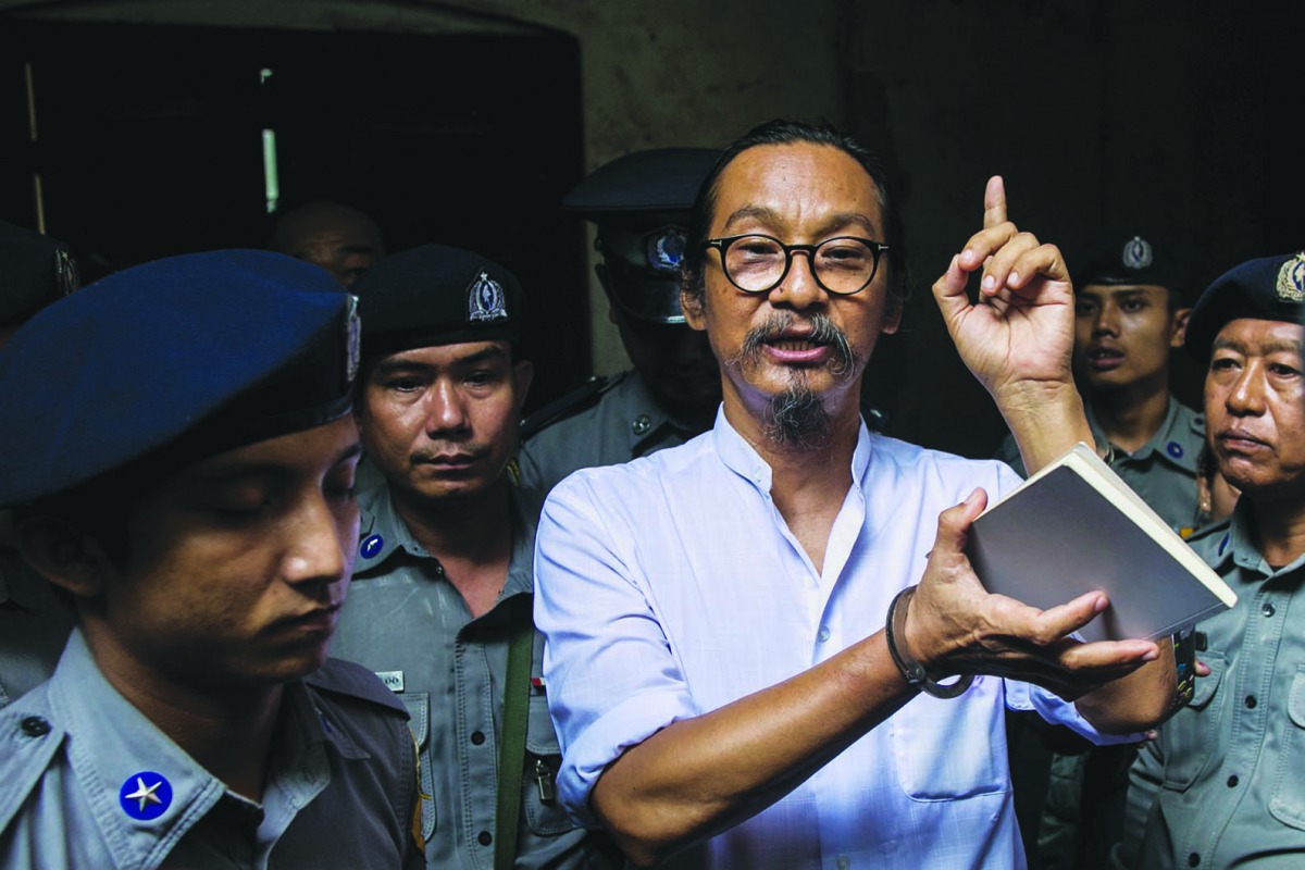 Myanmar human rights activist and film director Min Htin Ko Ko Gyi speaks to journalists after a court verdict in Yangon on August 29, 2019. AFP / Sai Aung Main