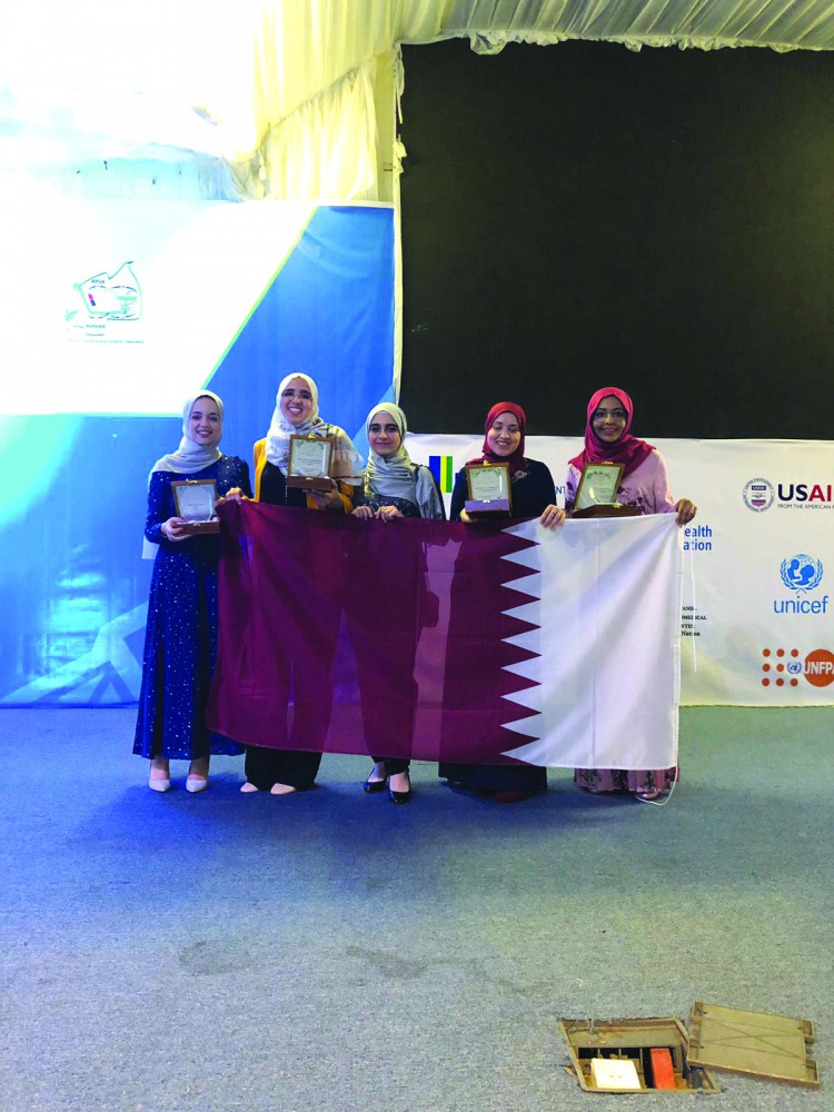 Qatar University College of Pharmacy students with their awards at the 65th IPSF World Congress in Rwanda.