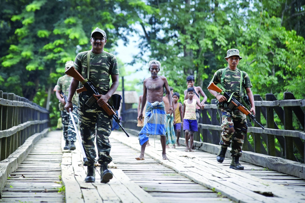 Security personnel patrol on a road ahead of the publication of the final draft of the National Register of Citizens (NRC) at Kachari Para village, in Hojai district, Assam, August 30, 2019. Reuters/Anuwar Hazarika