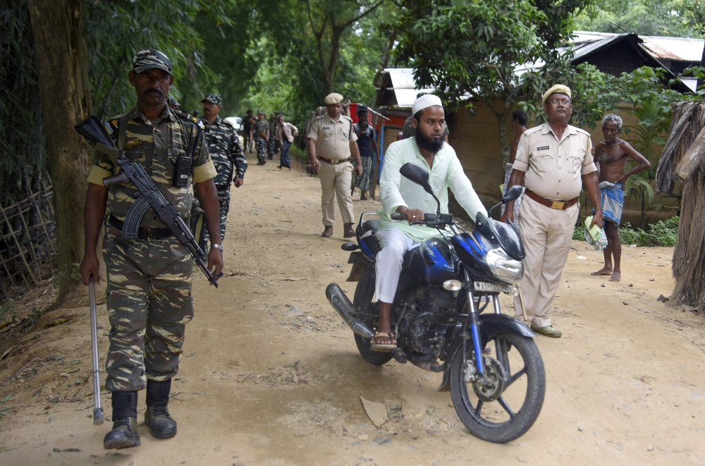 Indian security personnel patrol on a road ahead of the publication of the final draft of the National Register of Citizens (NRC) at Kachari Para village, in Hojai district, northeastern state of Assam, India August 30, 2019. REUTERS/Anuwar Hazarika