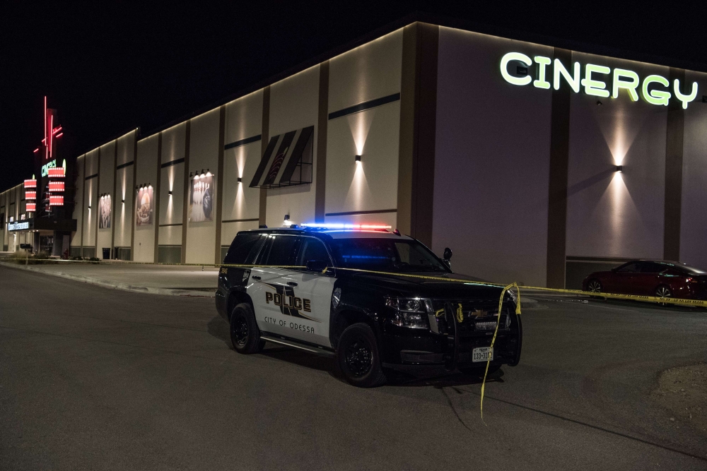 Police cars and tape block off a crime scene nearby to where a gunman was shot and killed at Cinergy Odessa movie theater after multiple people were shot on August 31, 2019, in Midland, Texas. Cengiz Yar/Getty Images/AFP