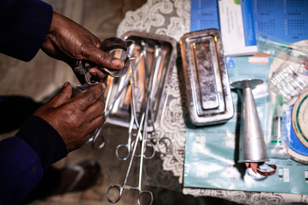 A woman practicing illegal abortion shows her working medical tools in her living room on July 25, 2019 in Antananarivo.  AFP / Gianluigi Guercia 