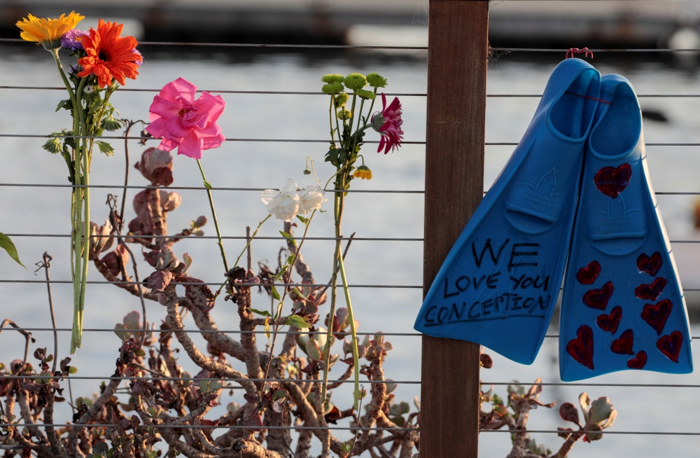Flowers are seen at a makeshift memorial near Truth Aquatics as the search continues for those missing in a pre-dawn fire that sank a commercial diving boat off a Southern California island near Santa Barbara, California, U.S., September 2, 2019. REUTERS/