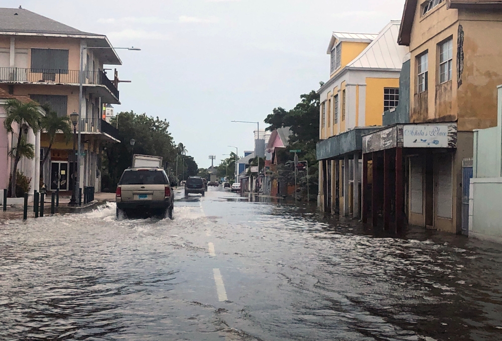 View of a flooded street in downtown Nassau on September 3, 2019. AFP / Lucy WORBOYS