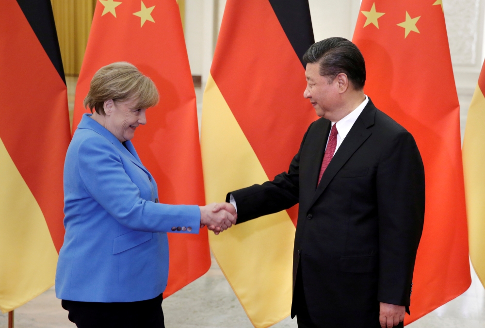 FILE PHOTO: China's President Xi Jinping meets German Chancellor Angela Merkel at the Great Hall of the People in Beijing, China, May 24, 2018. REUTERS/Jason Lee