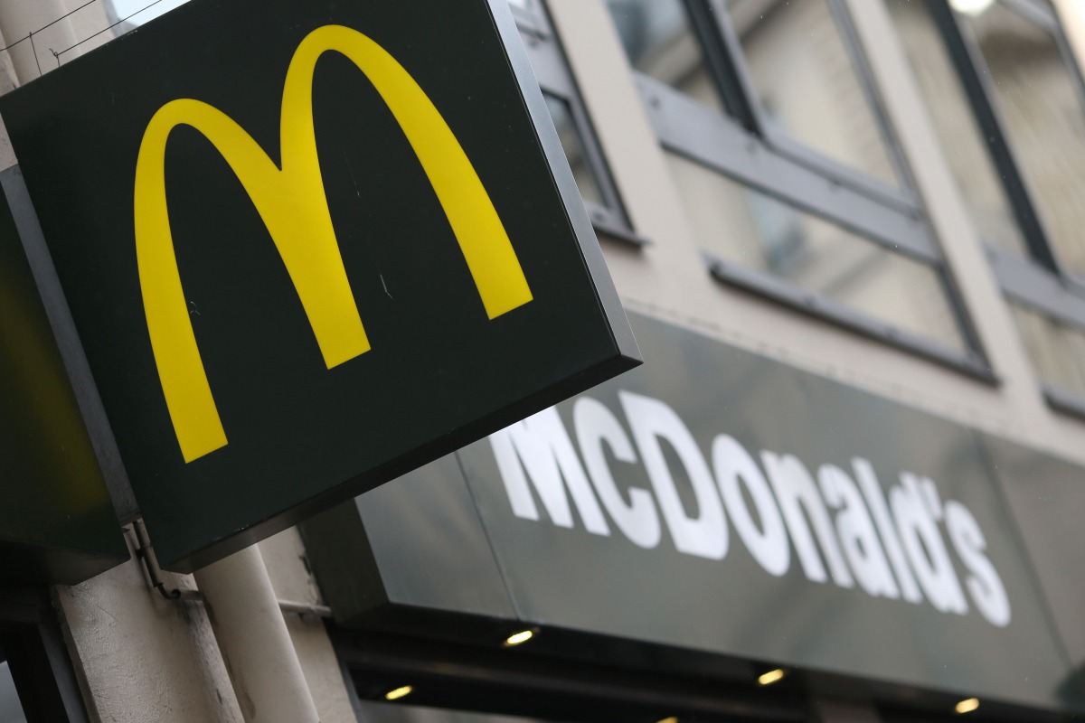 This file photo taken on January 22 2014 in Paris shows the logo of a US fast food restaurant McDonald’s . AFP / Kenzo Tribouillard
