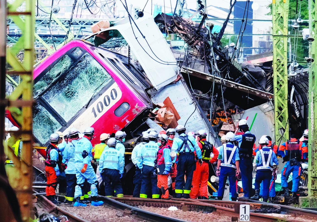 A train is seen derailed after a collision with a truck at a crossing in Yokohama, Kanagawa Prefecture on September 5, 2019. AFP / Kazuhiro Nogi