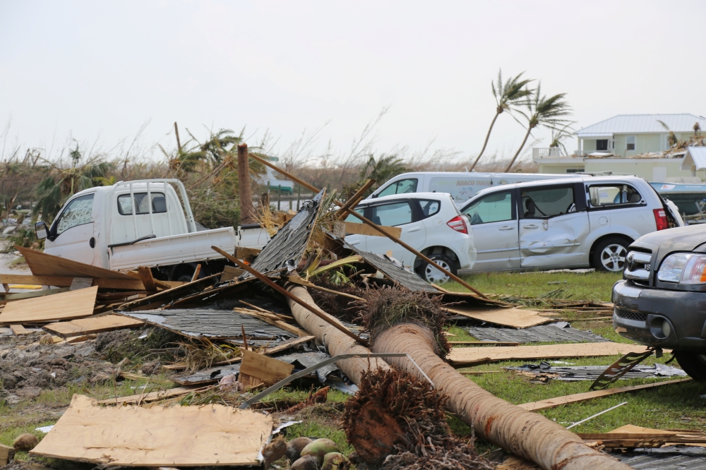 Damaged cars and trucks sit in a field following landfall by Hurricane Dorian, in Treasure Cay, Bahamas September 4, 2019. Seaman Erik Villa Rodriguez/US Coast Guard/ via Reuters