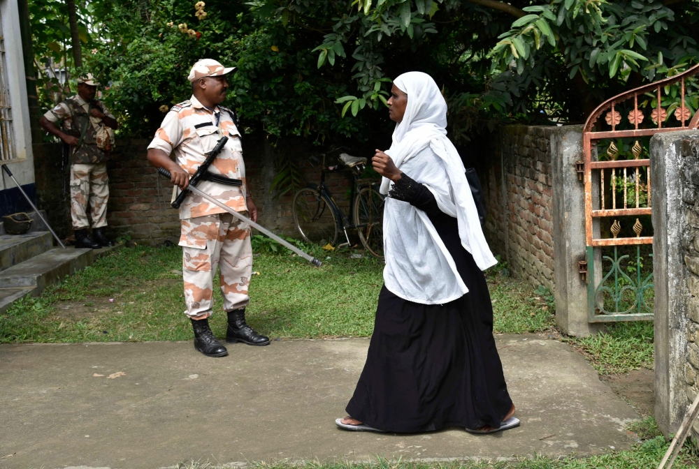 A woman arrives to check her name on the final list of the National Register of Citizens (NRC) in Morigaon district of Assam on August 31, 2019.  AFP / David Talukdar 