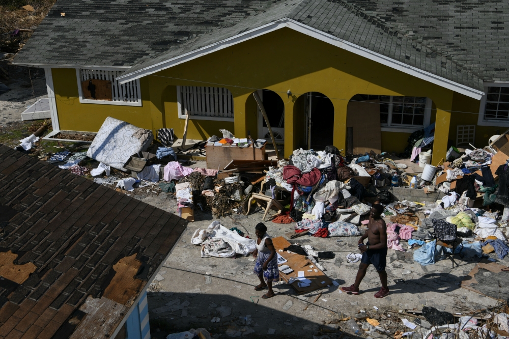 Residents work to salvage belongings near their homes in the wake of Hurricane Dorian in Marsh Harbour, Great Abaco, Bahamas, September 7, 2019. REUTERS/Loren Elliott