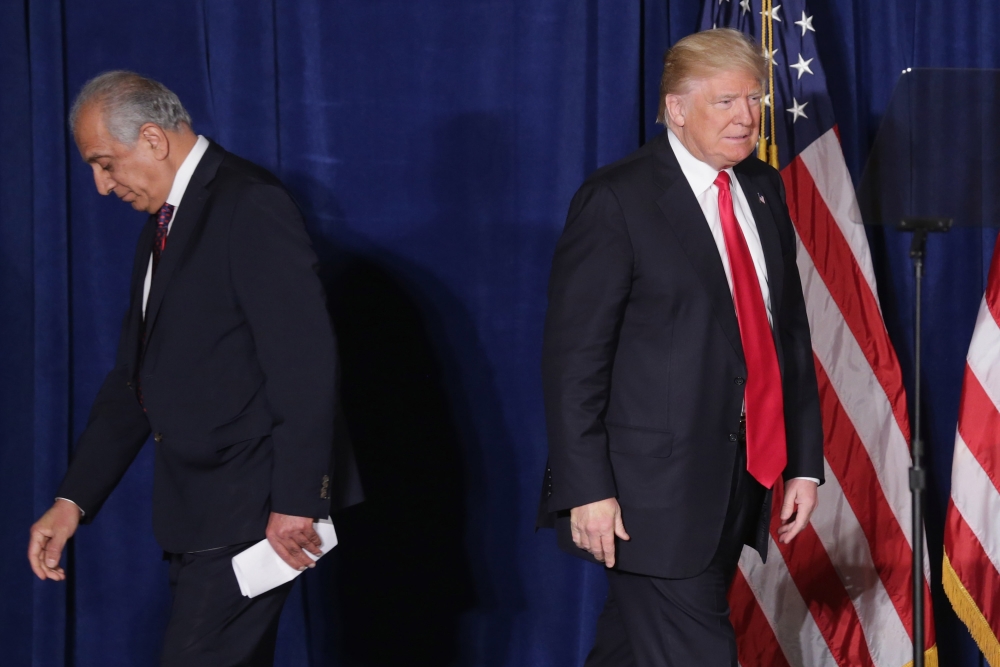 (FILES) In this file photo taken on April 27, 2016 Republican presidential candidate Donald Trump (R) takes the stage after being introduced by former U.S. Ambassador to Iraq and Afghanistan Zalmay Khalilzad at the Mayflower Hotel in Washington, DC. AFP /