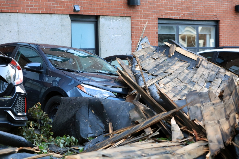 A roof landed on vehicles during Hurricane Dorian is seen in Halifax, Nova Scotia, Canada September 8, 2019. REUTERS/John Morris