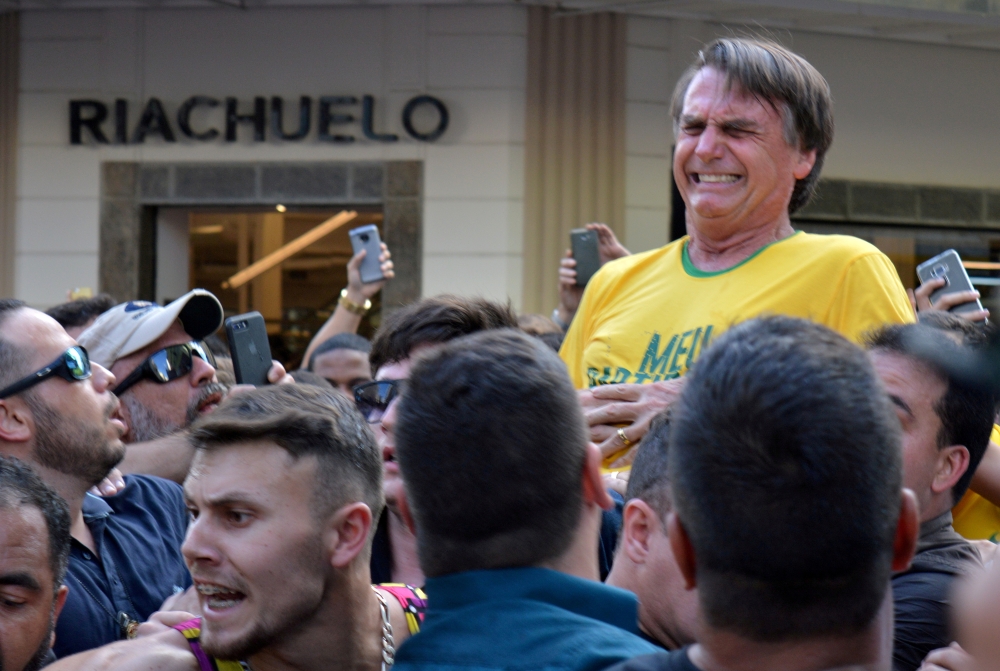 FILE PHOTO: Brazilian presidential candidate Jair Bolsonaro reacts after being stabbed during a rally in Juiz de Fora, Minas Gerais state, Brazil, September 6, 2018. REUTERS/Raysa Campos Leite