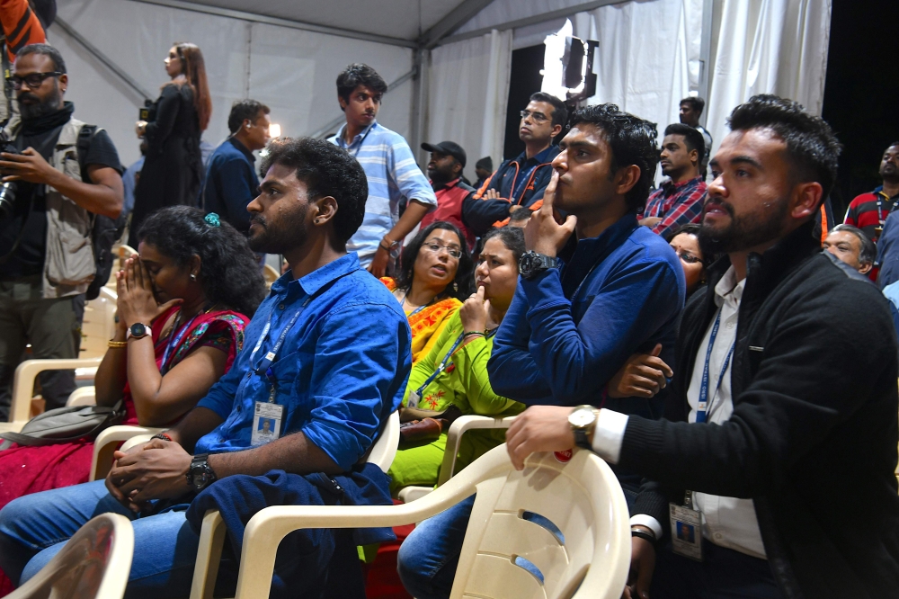 ISRO employees watch the live broadcast of the soft landing of spacecraft Vikram Lander of Chandrayaan-2 on the surface of the Moon at ISRO Telemetry, Tracking and Command Network centre in Bangalore early on September 7, 2019.  AFP / Manjunath Kiran 