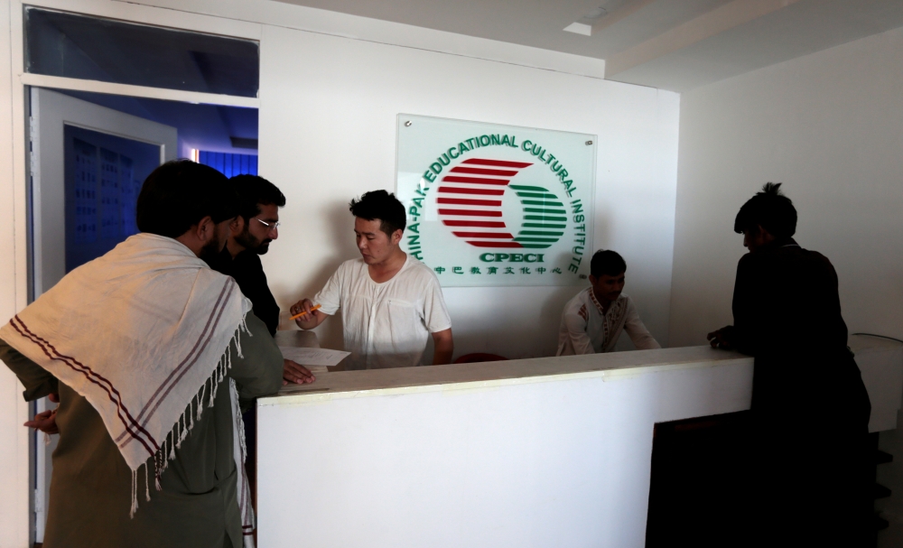 FILE PHOTO: Pakistani men sign up for Chinese language classes at the China Pak Cultural Educational Institute in Islamabad, Pakistan June 9, 2017. REUTERS/Caren Firouz/File Photo