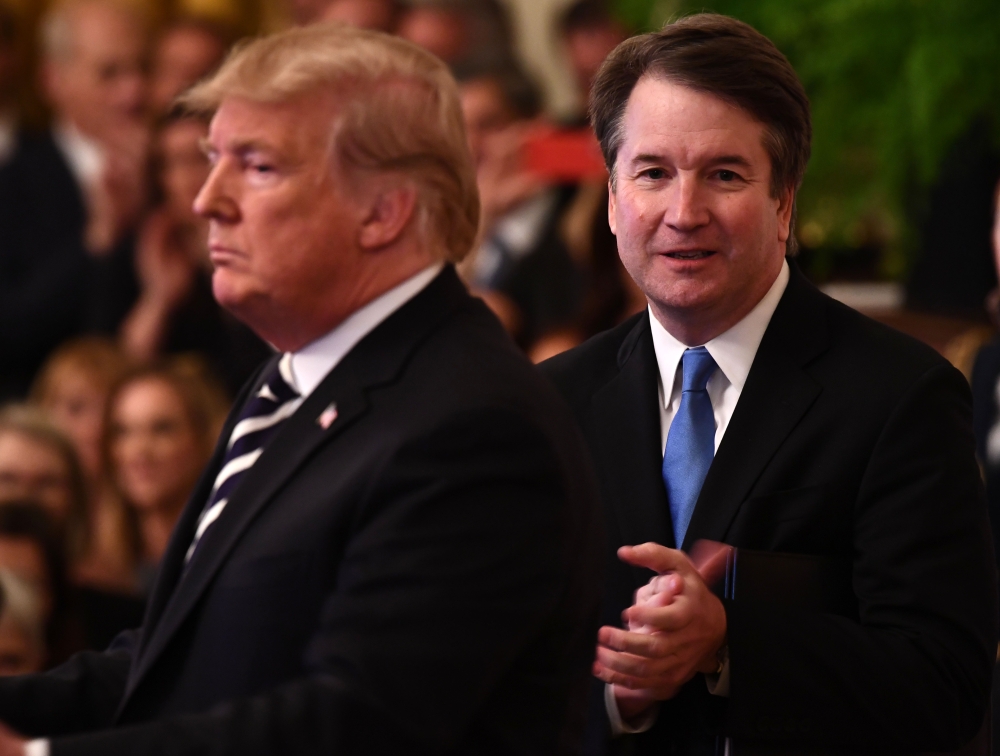 US President Donald Trump participates in the swearing-in ceremony of Brett Kavanaugh as Associate Justice of the US Supreme Court at the White House on October 08, 2018. AFP / Brendan Smialowski 