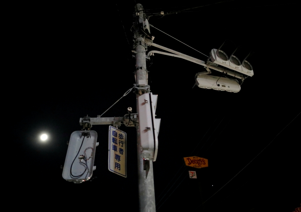 File photo of not working traffic signals are seen in a blackout caused by Typhoon Faxai in Kisarazu, Chiba prefecture, Japan September 9, 2019. REUTERS/Issei Kato/File Photo