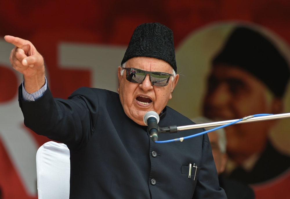 In this file photo taken on April 15, 2019 former Jammu and Kashmir chief minister Farooq Abdullah (C) speaks during an election campaign in Srinagar.  / AFP / Tauseef MUSTAFA 