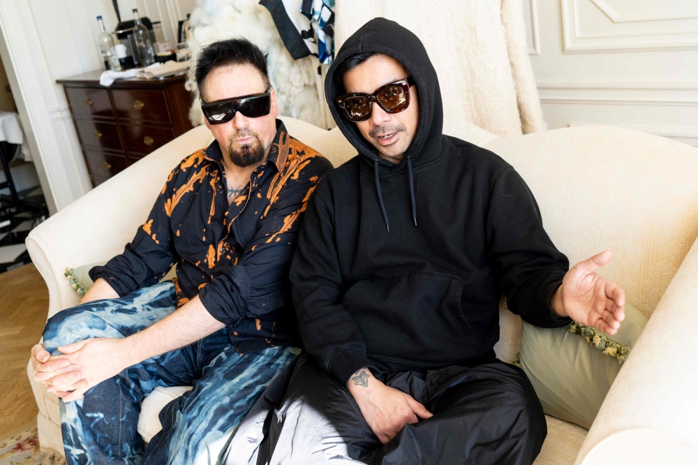 Fashion designers Vin + Omi pose for photograph during an interview with AFP at the Savoy Hotel in London on September 13, 2019.  AFP / Niklas Halle'n