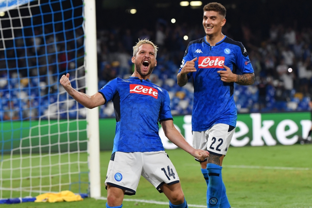 Napoli's Belgian forward Dries Mertens celebrates after scoring a penalty during the UEFA Champions League Group E football match Napoli vs Liverpool on September 17, 2019 at the San Paolo stadium in Naples. / AFP / Andreas SOLARO