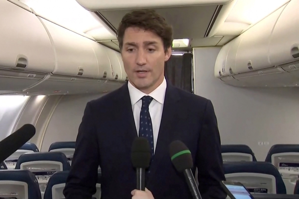 Canada's Prime Minister Justin Trudeau apologizes for wearing brownface makeup in 2001, to reporters on the Liberal party leader's election campaign jet in Halifax, Nova Scotia, Canada in a still image from video September 18, 2019. CBC via REUTERS.