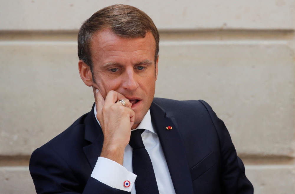 French President Emmanuel Macron reacts as he inaugurates the Commission on the first 1000 days of the child in Paris, France September 19, 2019. AFP/Philippe Wojazer