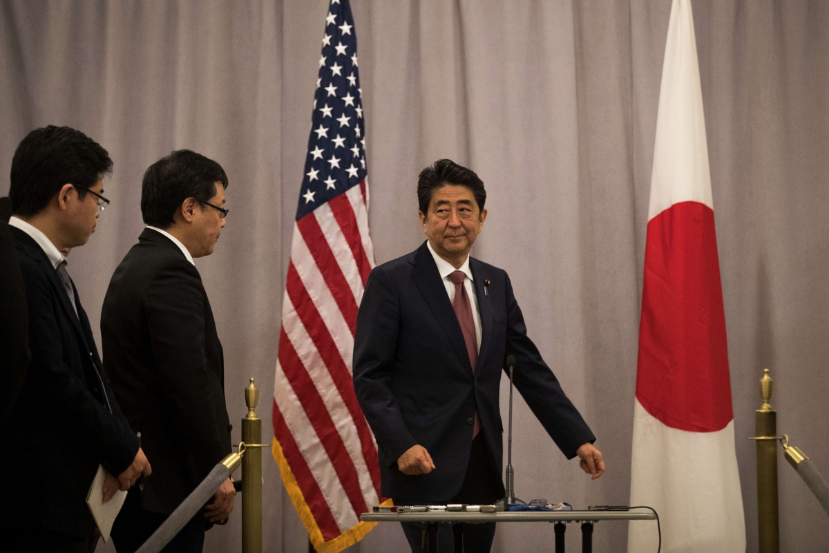 Japan Prime Minister Shinzo Abe arrives to speak to reporters following a meeting with President-elect Donald Trump, November 17, 2016 in New York City. Drew Angerer / Getty Images / AFP