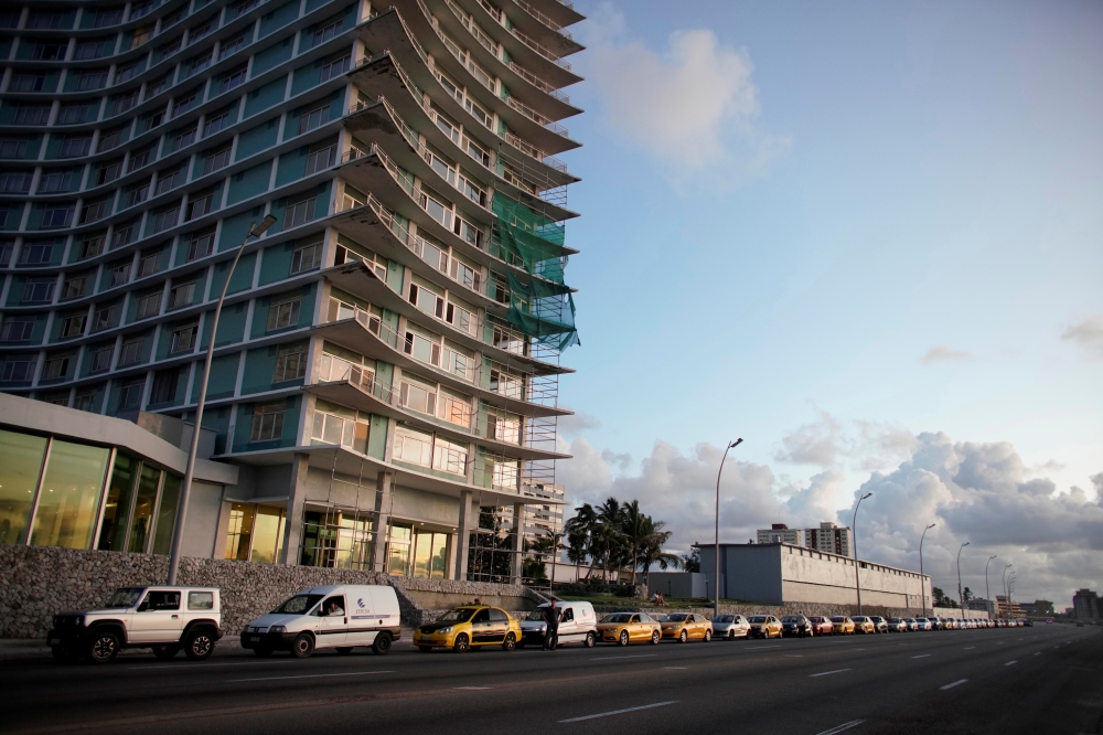 Cars line up for gas at the seafront Malecon in Havana, Cuba, September 17, 2019. Picture taken on September 17, 2019. Reuters/Alexandre Meneghini